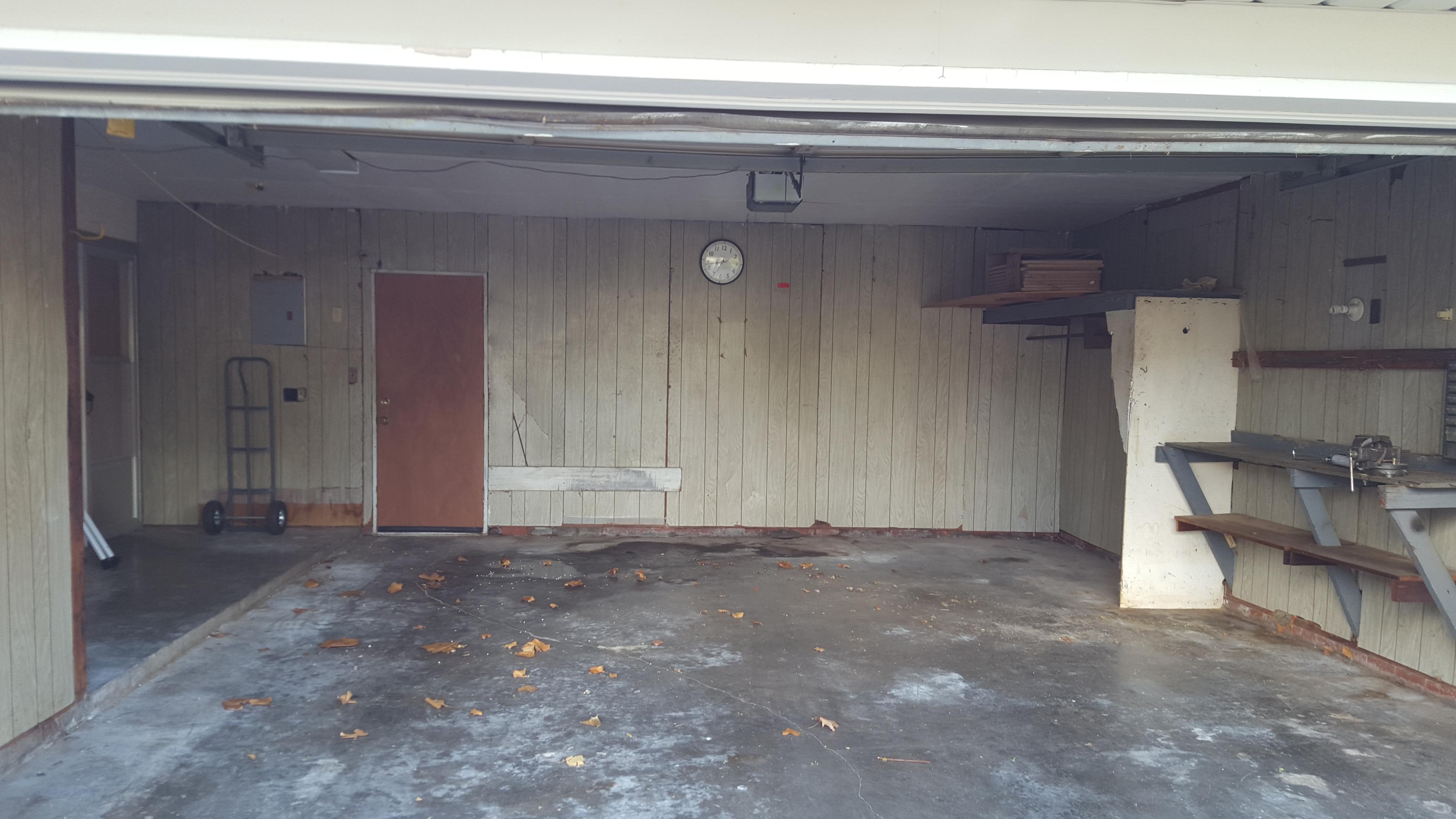 Garage with workbench and shelving